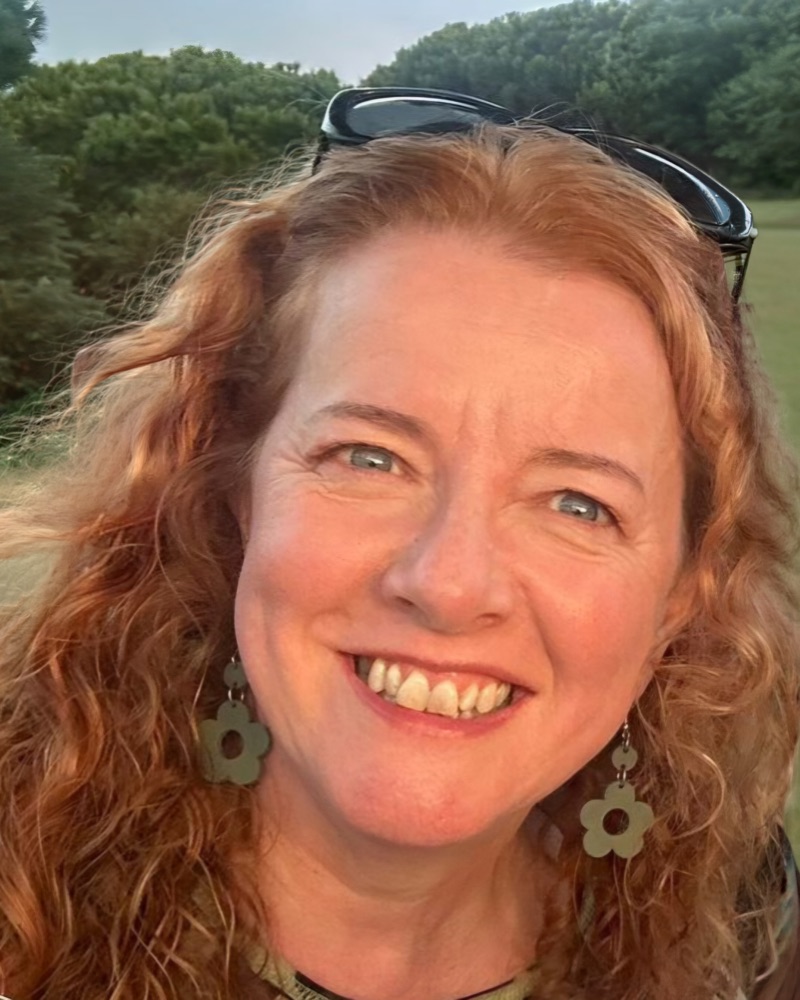 Corinne Thornton smiling outdoors